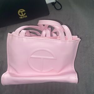 never used authentic mini pink telfar bag.